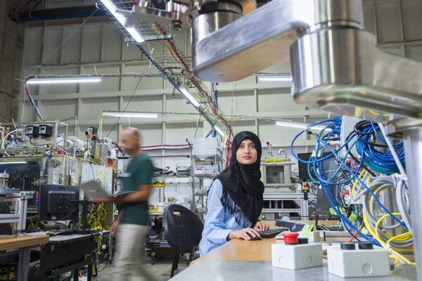 BCIT Engineering grads and students work with automated systems and robotics at Cytiva.